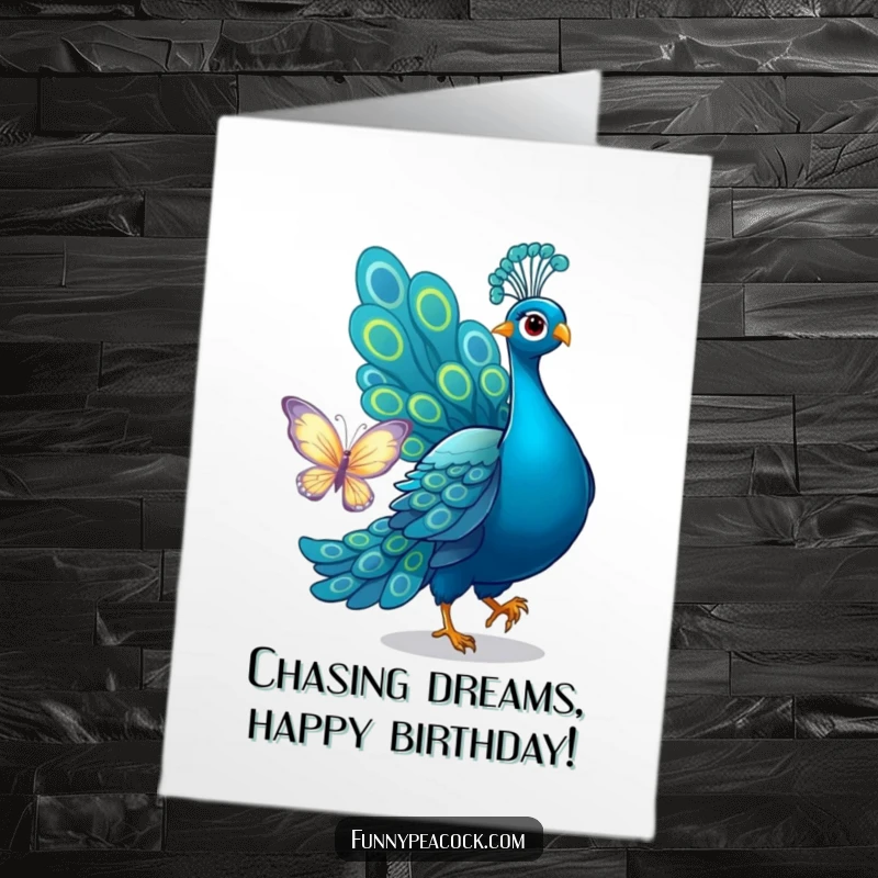 Funny Free Printable Birthday Card: Peacock playfully chasing a shimmering butterfly with its tail. Instant download.